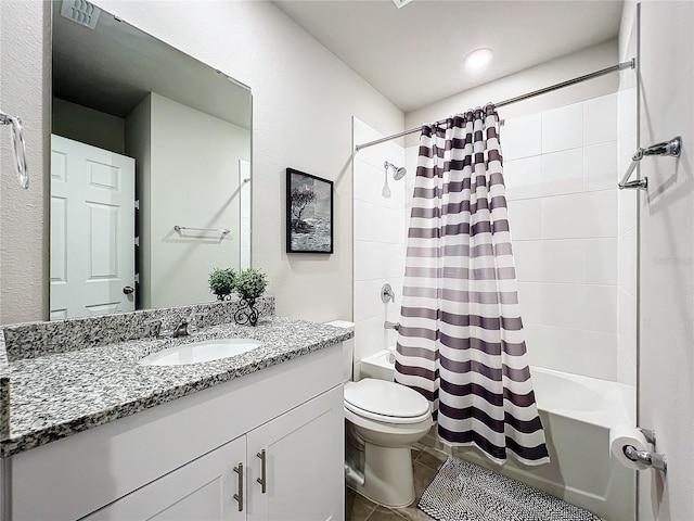 full bath featuring tile patterned flooring, toilet, vanity, and shower / bath combo