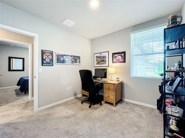 office area with light colored carpet, baseboards, and visible vents