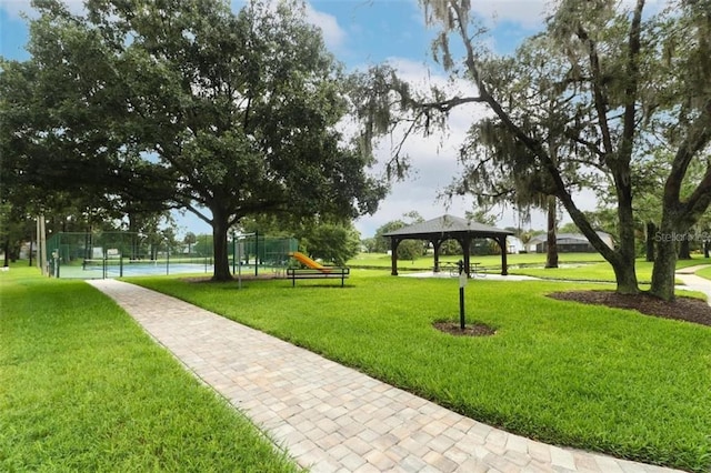 surrounding community with a playground, a yard, and a gazebo