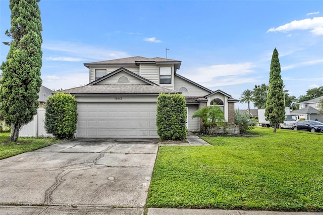 view of front property with a garage and a front lawn