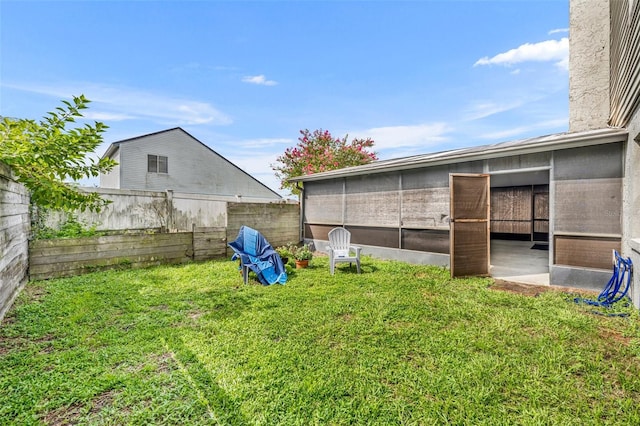 view of yard featuring a sunroom