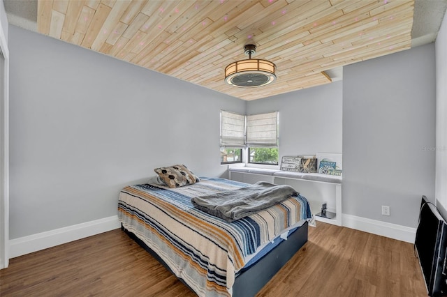 bedroom featuring wood ceiling and wood-type flooring