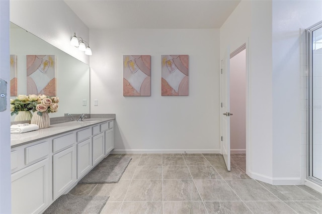 bathroom featuring vanity, a shower with shower door, and tile patterned floors