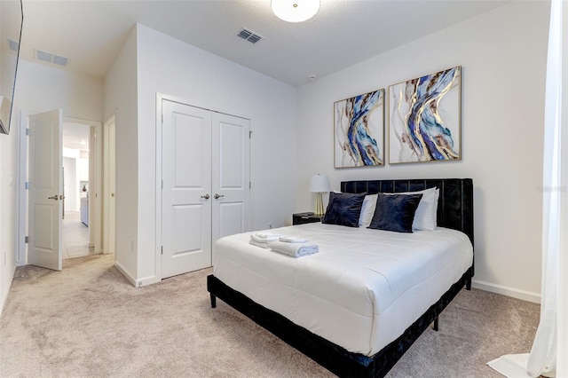 carpeted bedroom featuring a closet