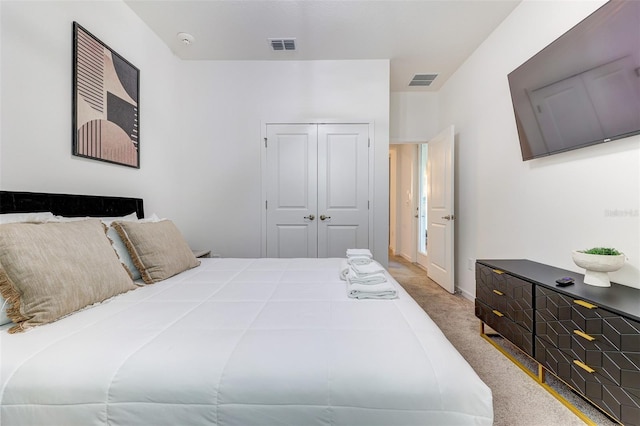 bedroom featuring carpet and a closet