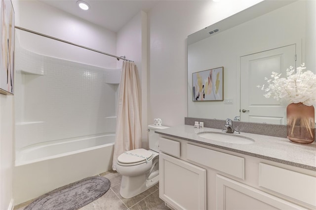 full bathroom with tile patterned floors, toilet, shower / tub combo with curtain, and vanity