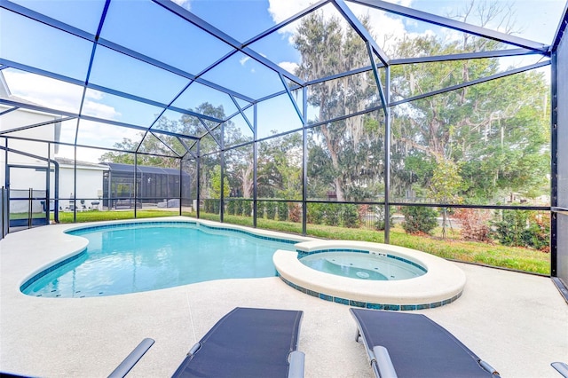 view of pool featuring a patio, a lanai, and an in ground hot tub