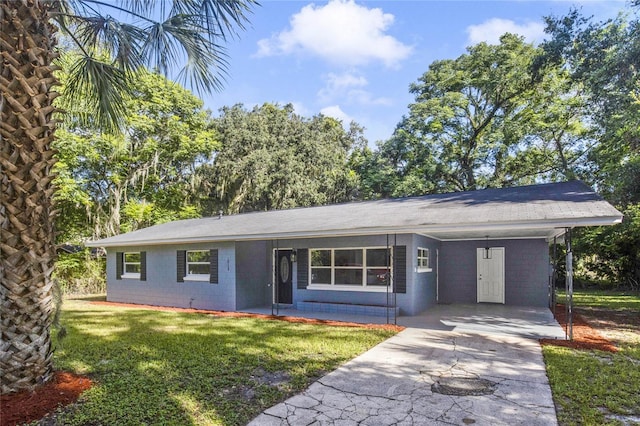 ranch-style house with a front yard and a carport