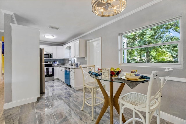 dining room featuring crown molding, a wealth of natural light, light tile patterned floors, and a notable chandelier