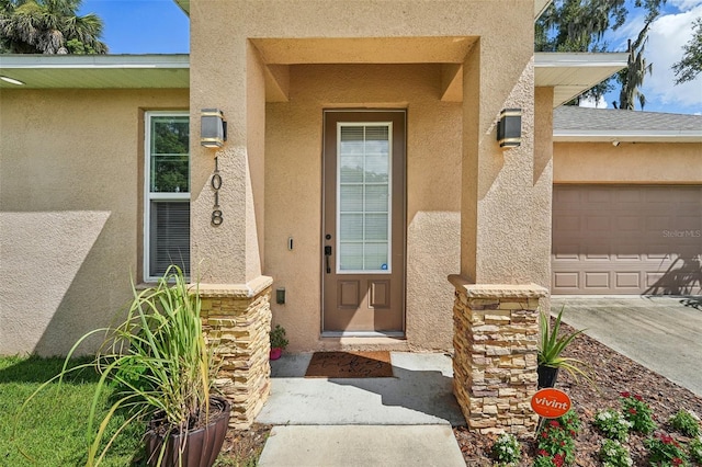 entrance to property featuring a garage