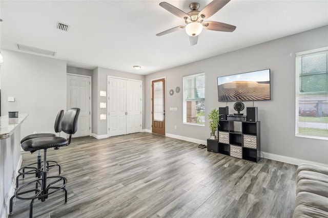 interior space featuring hardwood / wood-style flooring and ceiling fan