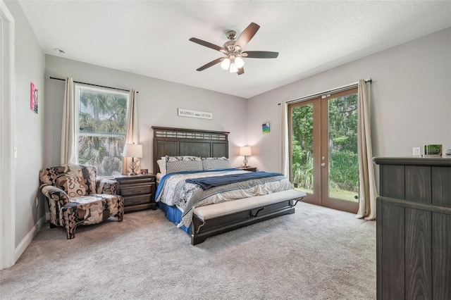 bedroom featuring french doors, access to outside, ceiling fan, and light colored carpet