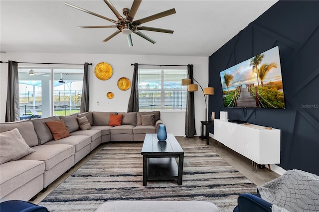 living room featuring a wealth of natural light, hardwood / wood-style floors, and ceiling fan