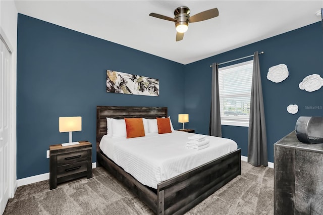 bedroom featuring ceiling fan and carpet