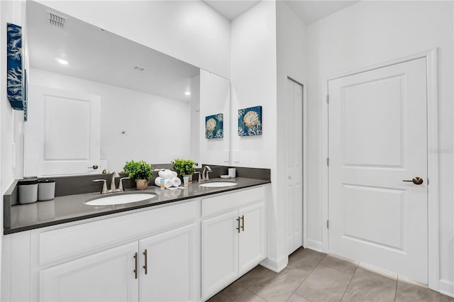 bathroom featuring vanity and tile patterned flooring