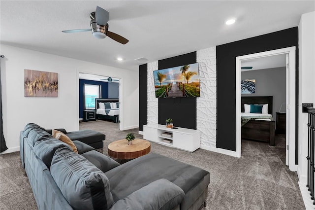 carpeted living room with ceiling fan