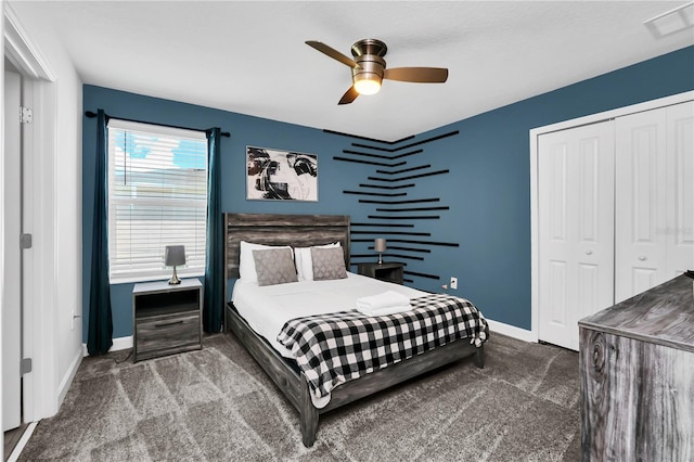 bedroom featuring carpet floors, ceiling fan, and a closet