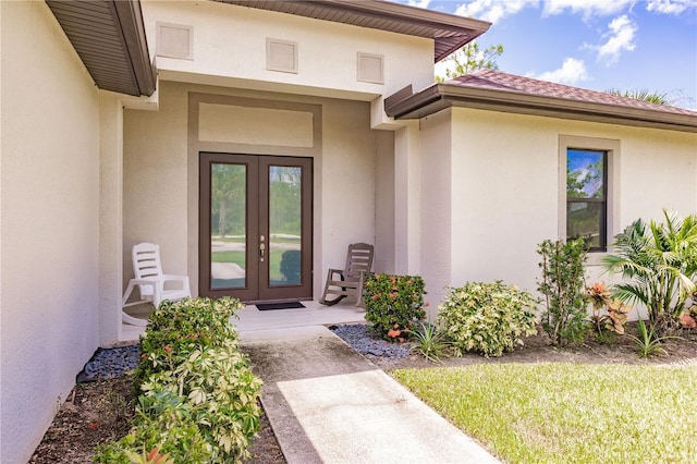 property entrance featuring french doors