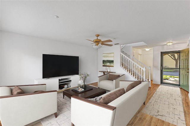 living room with ceiling fan and light hardwood / wood-style floors