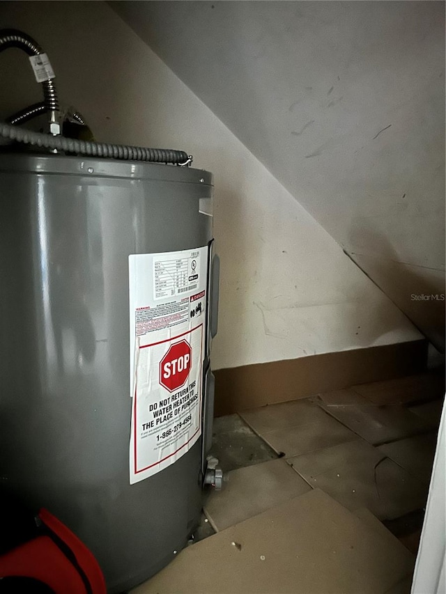 utility room with water heater