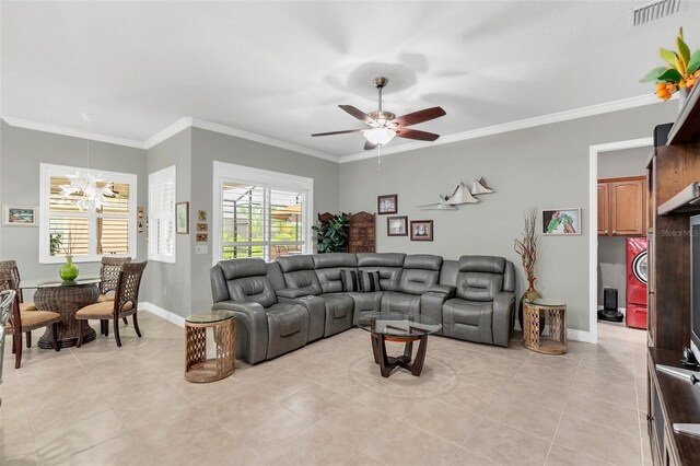 living room featuring ceiling fan with notable chandelier, light tile patterned floors, and ornamental molding