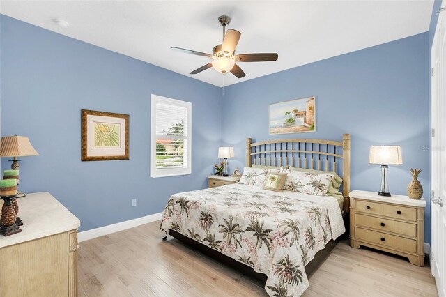 bedroom featuring light wood-type flooring and ceiling fan