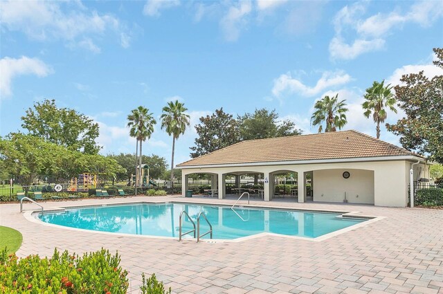 view of swimming pool with a patio