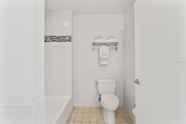 bathroom with tile walls, independent shower and bath, toilet, and tile patterned floors