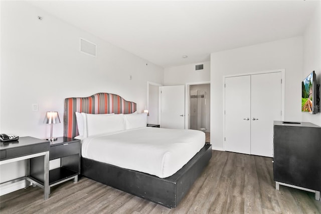 bedroom featuring a closet and wood-type flooring