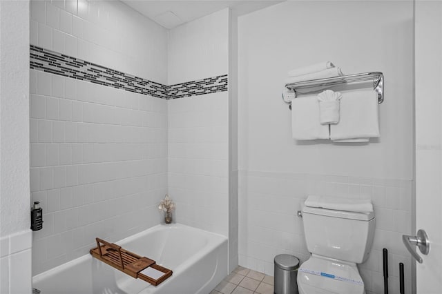 225 Celebration Pl Unit 427, Celebration, FL 34747 - bathroom featuring tile walls, tile patterned floors, and wainscoting