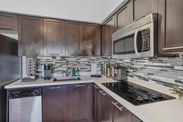 225 Celebration Pl Unit 427, Celebration, FL 34747 - kitchen featuring stainless steel appliances, light countertops, and backsplash
