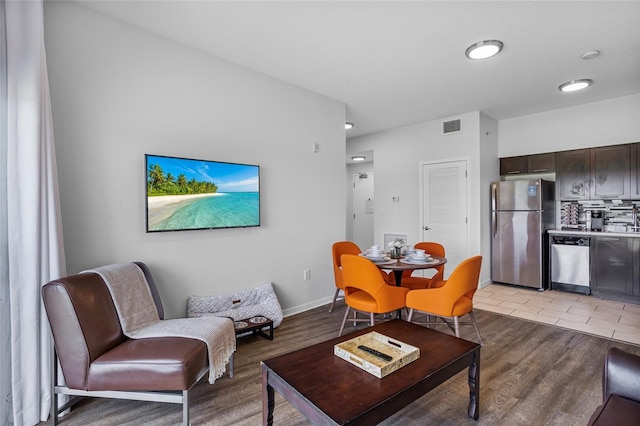 225 Celebration Pl Unit 427, Celebration, FL 34747 - living area with light wood finished floors and baseboards