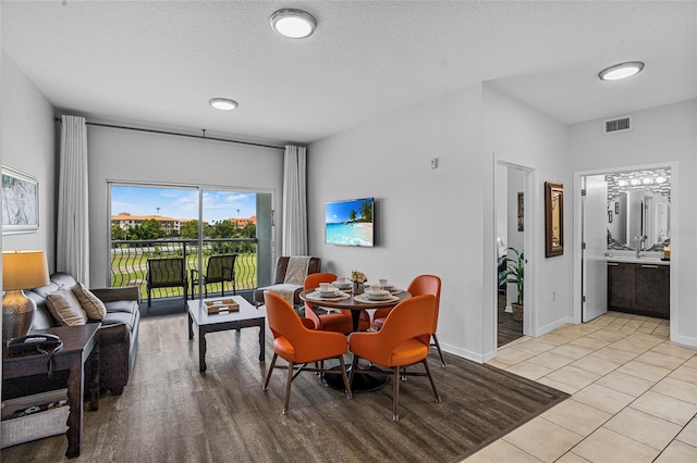 225 Celebration Pl Unit 427, Celebration, FL 34747 - dining area featuring light tile patterned floors and a textured ceiling