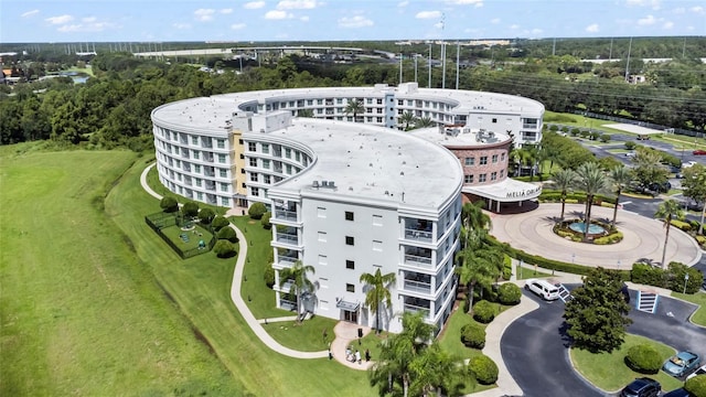 225 Celebration Pl Unit 427, Celebration, FL 34747 - aerial view of apartment complex / building and a tree filled landscape