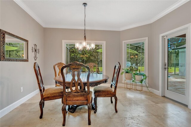 dining area featuring a chandelier, a healthy amount of sunlight, and ornamental molding