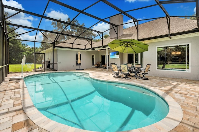 view of pool with a lanai and a patio