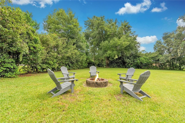 view of yard with a fire pit