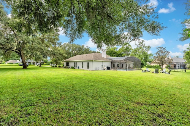 view of yard with a lanai