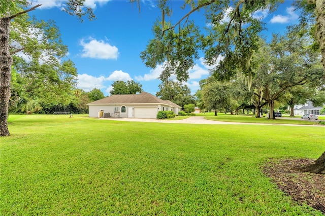 view of yard featuring a garage