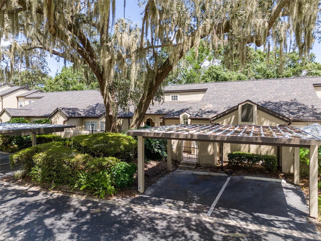 view of car parking featuring a carport