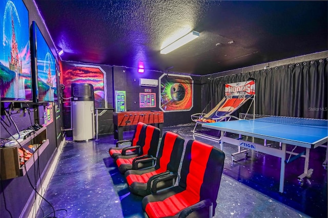 recreation room with a textured ceiling