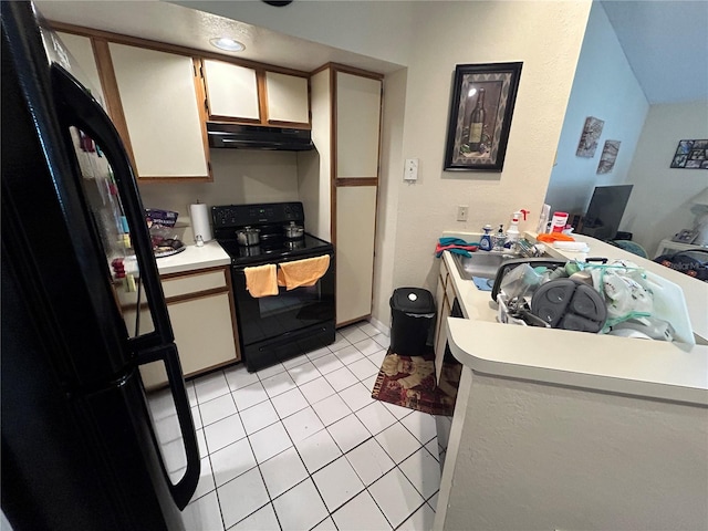 kitchen featuring light tile patterned floors, a sink, black appliances, light countertops, and under cabinet range hood