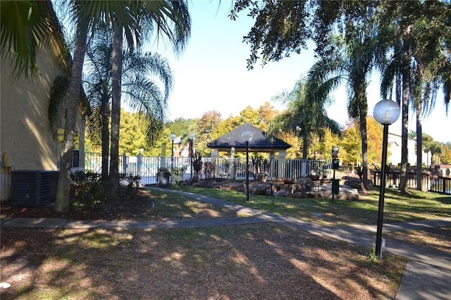 view of property's community featuring fence