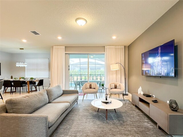 living room featuring a textured ceiling