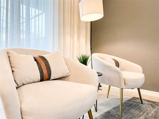 sitting room with tile patterned floors