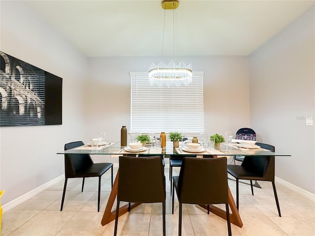 dining area featuring baseboards and light tile patterned floors