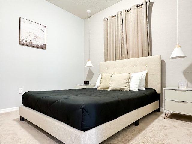 bedroom featuring vaulted ceiling, carpet flooring, and baseboards