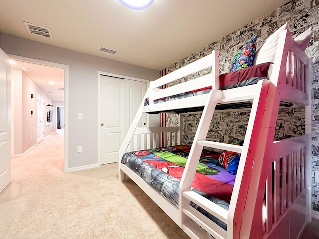 bedroom featuring a closet and carpet floors