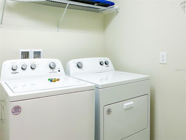 clothes washing area featuring washing machine and dryer