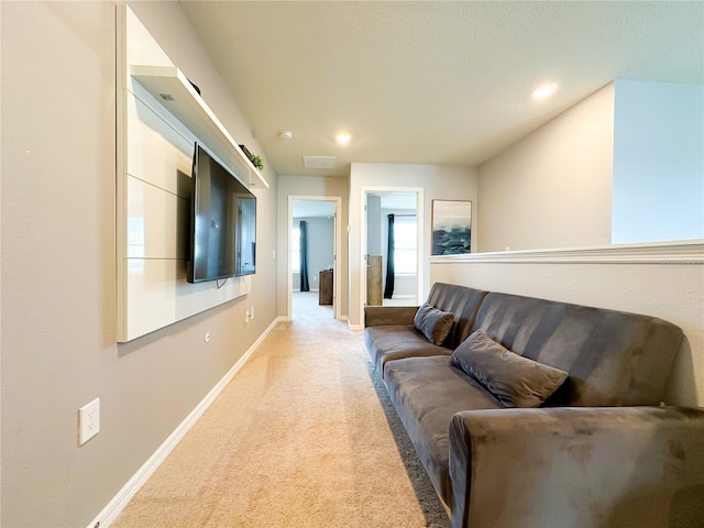 living room featuring recessed lighting, light colored carpet, visible vents, and baseboards